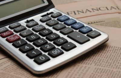 Calculator on financial newspaper