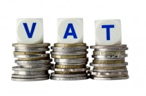 VAT Sign on piles of coins