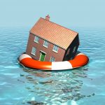 House resting on a life ring to illustrate flood-damaged rental property risk