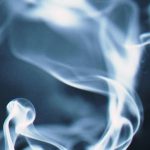 Swirling smoke against a dark background, symbolizing fire safety concerns in housing.