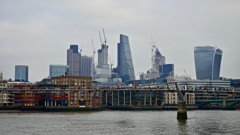 London skyline with modern office buildings and residential conversions along the Thames