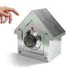 Hand reaching toward a house-shaped safe representing secure rental deposits