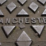 Manchester sign on a street paving