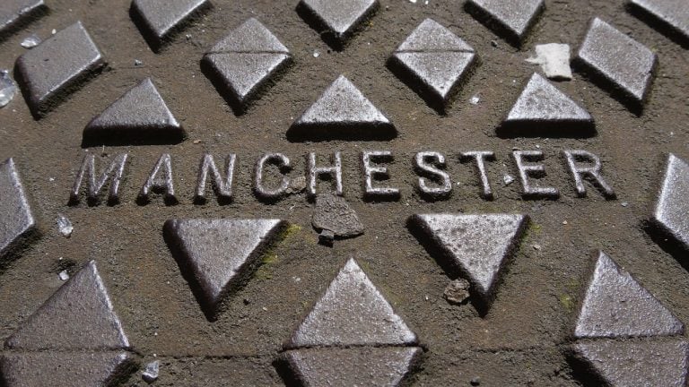 Manchester sign on a street paving