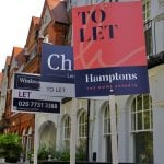 Row of “To Let” signs outside terraced houses in the UK, symbolising the rental housing market.