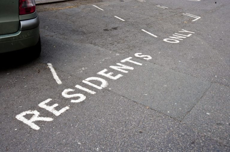 Residents-only parking bay markings on a shared residential car park