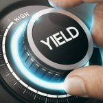 Close-up of a dial being turned to increase rental yield to high levels