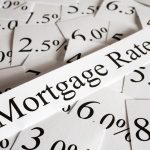 Mortgage rate percentages representing falling BTL and bridging loan rates for landlords