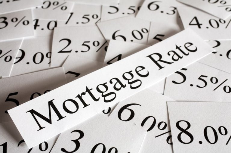 Mortgage rate percentages representing falling BTL and bridging loan rates for landlords