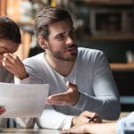 Frustrated tenants discussing tenancy concerns with a letting agent