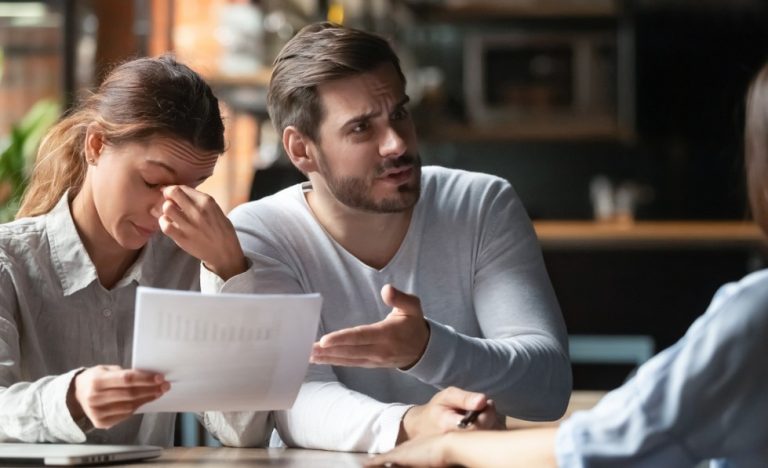 Frustrated tenants discussing tenancy concerns with a letting agent