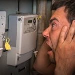 man looking aghast at fuel meters property118.com