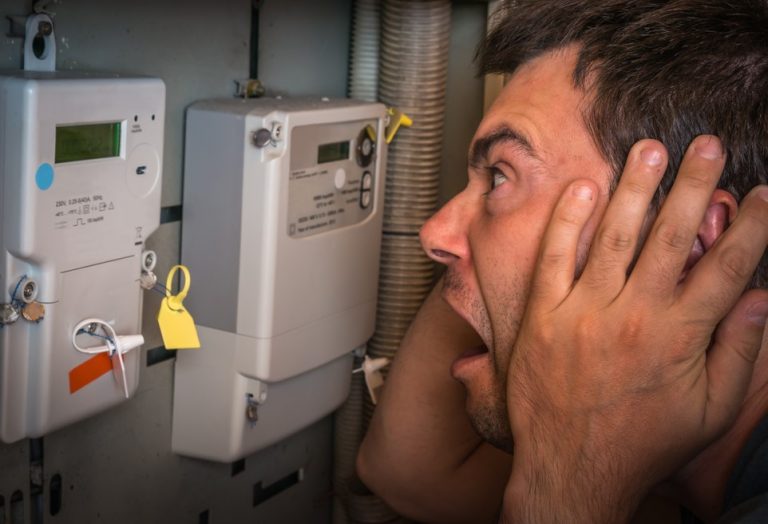 man looking aghast at fuel meters property118.com