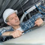 Electrician rewiring a rented flat property118.com