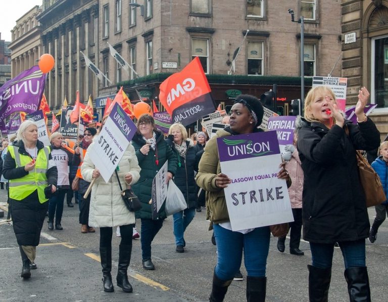 unite union workers on strike marching property118.com