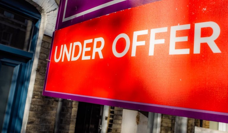 picture of under offer board outside house