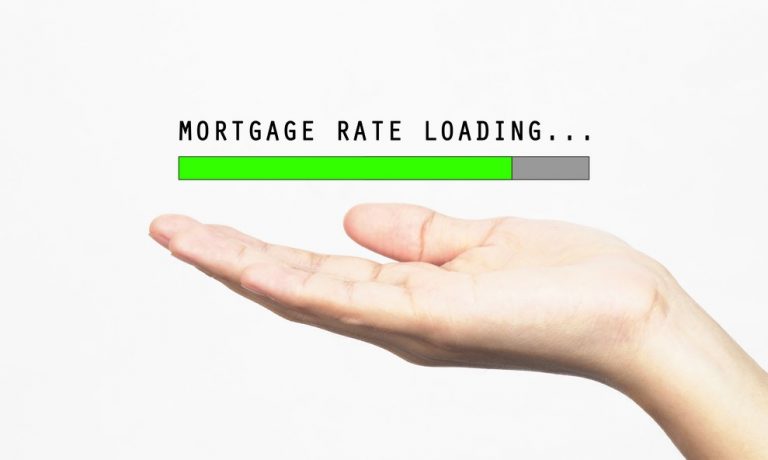 Hand holding an image of mortgage ates property118.com