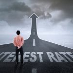 man looking at a road of interest rate rises BoE base rate rise property118.com