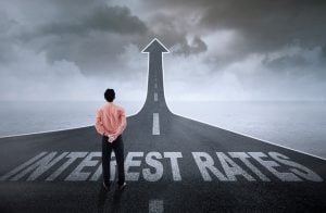man looking at a road of interest rate rises BoE base rate rise property118.com