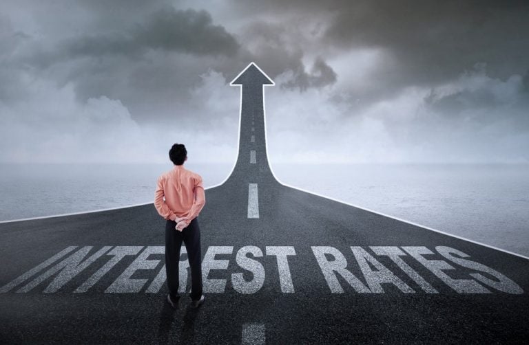 man looking at a road of interest rate rises BoE base rate rise property118.com