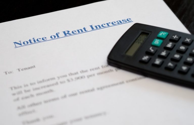 Rent increase notice with calculator on top of tenancy letter