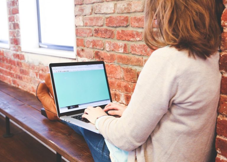 Young woman student typing in PBSA accommodation property118.com