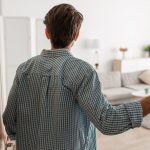 Young man entering room rent guarantor landlord question property118.com