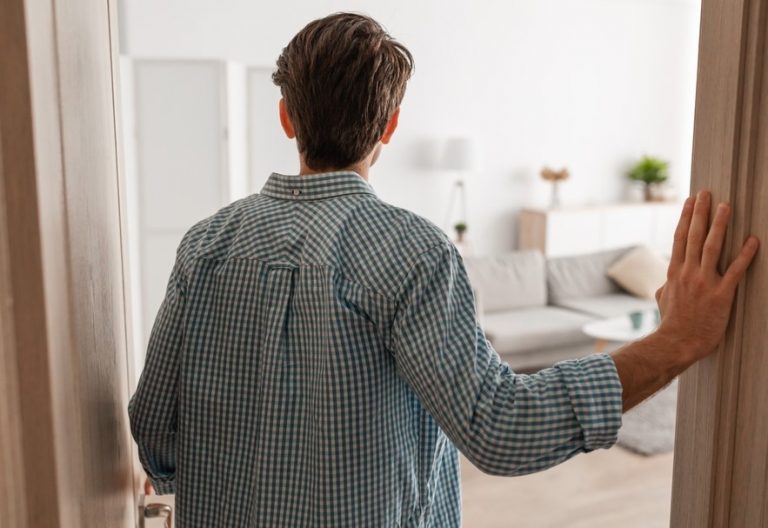 Young man entering room rent guarantor landlord question property118.com