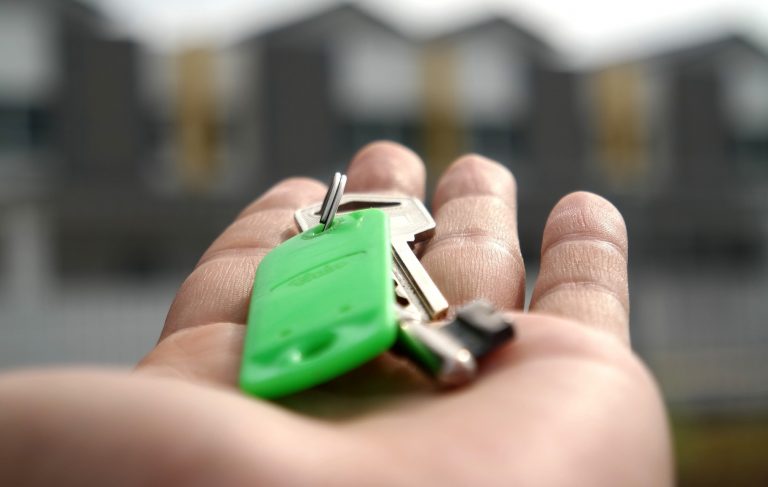 Hand holding key Equity charge BTL mortgage landlord property118.com