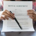 landlord holding tenancy agreement how to best increase rents property118.com