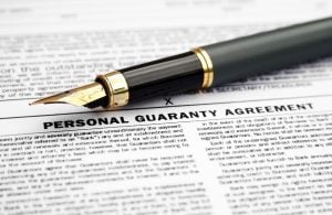 Pen and a personal guarantee contract for a landlord with a limited company property118.com