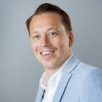 Landbay's sales and distribution director, Rob Stanton wearing a light blue suit and white shirt