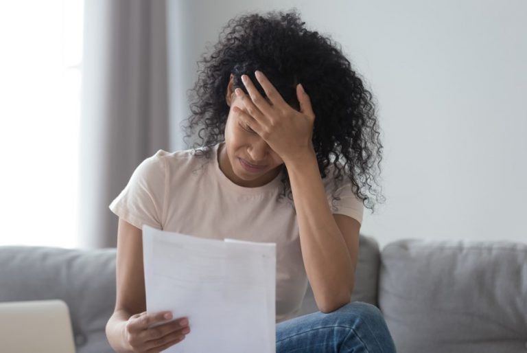 Woman reading an eviction notice landlord property118.com