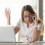 Pic of frustrated woman landlady dealing with UC helpline property118