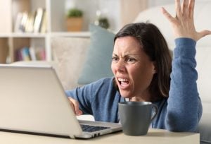 Fed up woman landlord at laptop troublesome student tenants property118.com