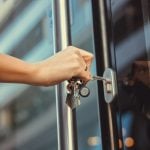 Pic of woman unlocking a tenants door locks changed landlord property118.com