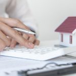 Pic of landlord checking portfolio and property prices property118