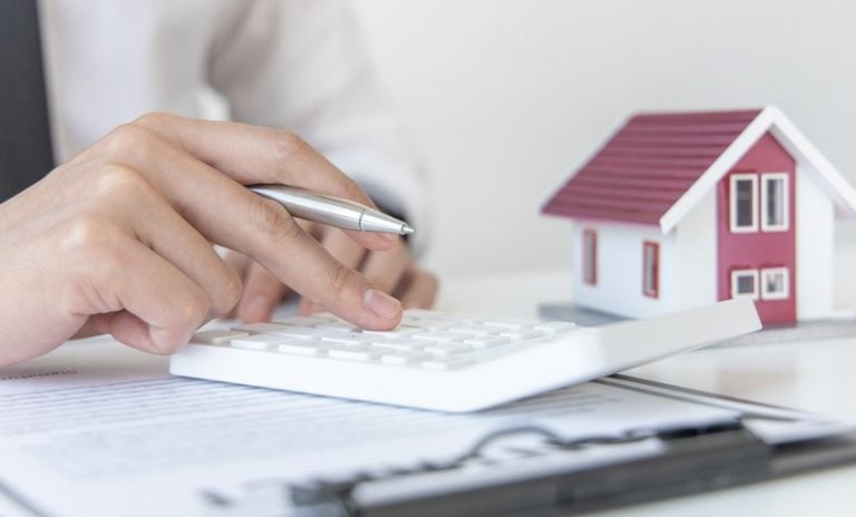 Pic of landlord checking portfolio and property prices property118