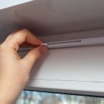 Landlord opening trickle vent to ventilate a rented property