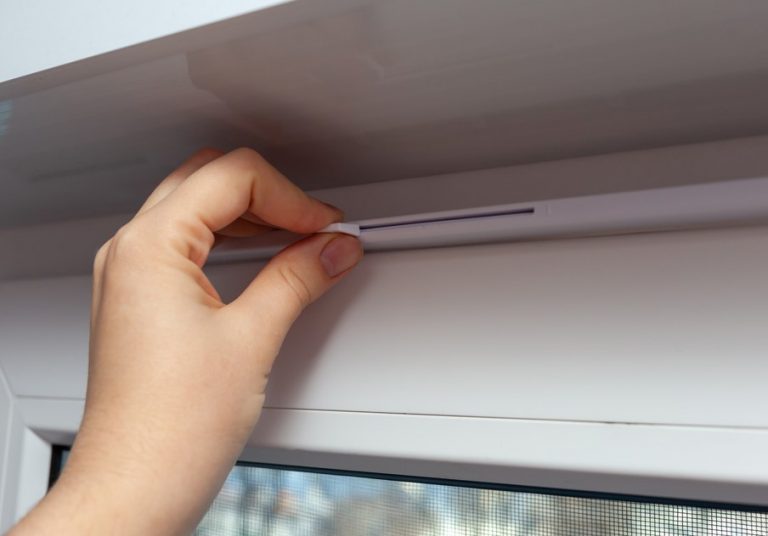 Landlord opening trickle vent to ventilate a rented property