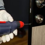 Pic of locksmith changing night latch for tenants who pays property118