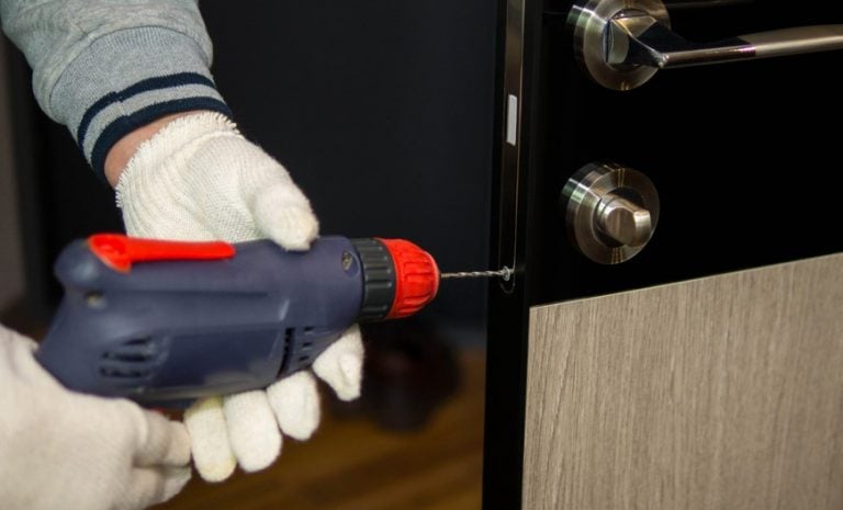 Pic of locksmith changing night latch for tenants who pays property118