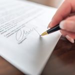 Pic of tenant signing a tenancy agreement estate agent landlord property118