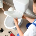 Plumber fixing a blocked toilet landlord inventory property118