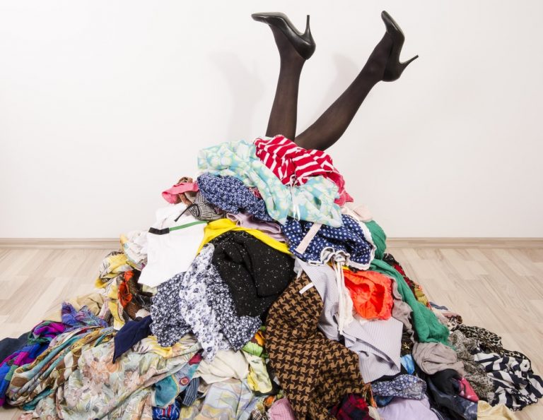 Pic of woman stuck in pile of clothes blocked fire escape HMO landlord property118