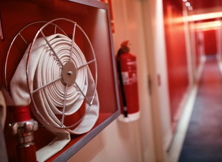 Pic of fire hose and extinguisher tenant communication fire safety property118