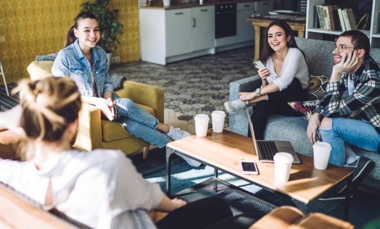 Students sitting around a coffee table