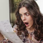 pic of woman landlord looking shocked at a managing agents bill property11