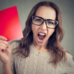 pic of woman holding a red card as a penalty for landlords in the uk property118