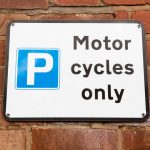 Pic of motorbike parking sign management company uses parking space property118